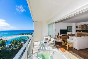 a living room with a view of the ocean at Ilikai Tower 1228 in Honolulu