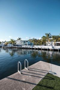 a dock with a ramp in a body of water at Waterfront Cabana 6 Key Largo in Key Largo