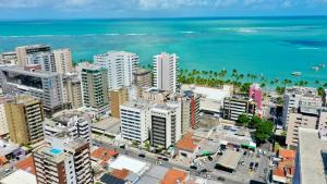 an aerial view of a city with the ocean at Top Unique Maceió in Maceió