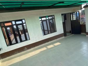 a rendering of a house with windows and a door at Shawn's Hub in Ruaka