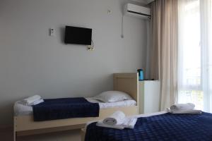 Llit o llits en una habitació de Hotel Niniko