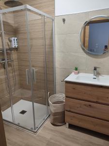 a bathroom with a shower and a sink at apartamentos YEIK in Muxia +66 photos