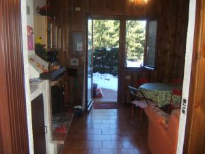 a kitchen with a table and a door to a yard at Montanara Home in Camigliatello Silano +58 photos