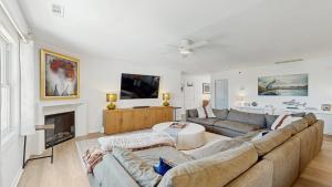 a living room with a couch and a fireplace at Rehoboth Beach - 24 Brooklyn Ave Unit E in Rehoboth Beach