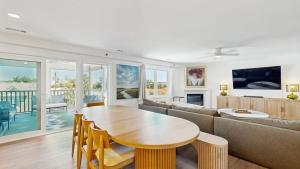 a living room with a table and a couch at Rehoboth Beach - 24 Brooklyn Ave Unit E in Rehoboth Beach