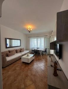 a living room with a couch and a table at Blue Horizon in Cabo Negro