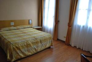 Letto o letti in una camera di Hotel Tre Torri