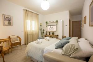 a bedroom with a bed with two pillows on it at Kama House 96 mq in centro in Lesina +15 photos