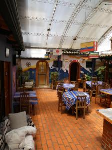 a restaurant with tables and chairs in a room at Greenhouse Bolivia in La Paz +171 photos