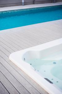 a bath tub sitting next to a swimming pool at Top Rentals Downtown in Buenos Aires