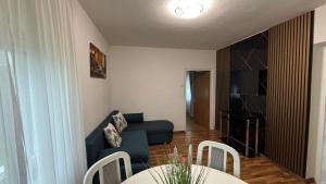 a living room with a couch and a table at Alina in Graz