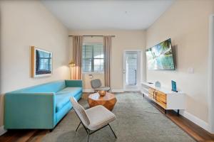 a living room with a blue couch and a table at Vista Cay Resort by Millenium at Universal Blvd. in Orlando