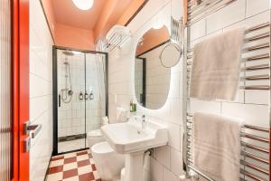 a bathroom with a sink and a toilet at CasaMichelin in Marina di Massa +18 photos