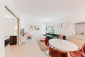 a living room with a couch and a table at Joinery North in Charlotte