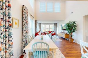 a dining room with a table and chairs at Bishop's Landing -- 31186 VICTOR RD in Millville +23 photos