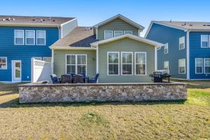 a house with a patio with chairs in front of it at Bishop's Landing -- 31186 VICTOR RD in Millville