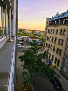 a view of a street from a window of a building at Nürnberg Nähe Studio in Fürth +8 photos