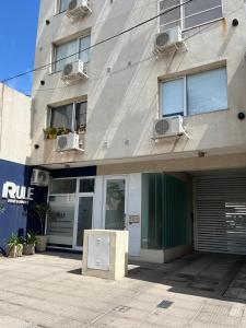 a building with an appliance in front of it at Blandengues 55 in Bahía Blanca