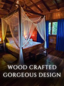 a bedroom with a bed with a canopy at The River House in Puerto Quito +19 photos