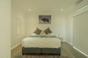 a bedroom with a large bed in a room at theLAB BLUE in Franschhoek +36 photos