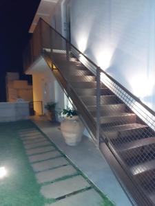 a set of stairs leading up to a building at Nacàri Home in Giardini Naxos