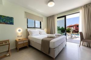 a bedroom with a large bed and a balcony at TATOLI Villas in Minia +252 photos