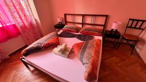 a bedroom with two bunk beds and two chairs at Fogadó a Kóbor Macskához in Kőszeg