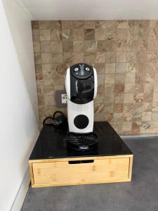 a coffee maker sitting on top of a counter at Tropea Olympus Apartments in Santa Domenica