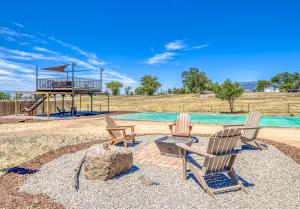 a group of chairs sitting next to a playground at Basecamp 2 at the Cedaredge Lodge in Cedaredge
