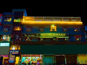 a hotel with a sign on the side of a building at Hotel Shaan- M I Road City Centre in Jaipur +5 photos