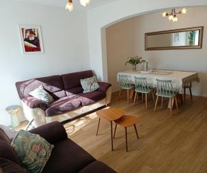 a living room with a couch and a table at Neoth Deshe 770 in Safed