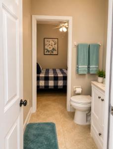 a bathroom with a toilet and a sink at The Garden, Miami Lakes in Miami Lakes +15 photos