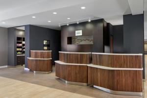a lobby of a salon with wooden counters at Courtyard Providence Downtown in Providence