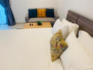 a bedroom with a bed and a couch at Executive Studio at Bantree in Accra +22 photos