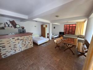 a living room with a couch and a table at Vila Madi in Vama Veche