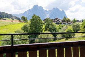 a balcony with a view of a mountain at Apartments Karbon in Castelrotto +3 photos