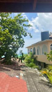 a building with a water tower on top of it at 1Fusion2 in Negril