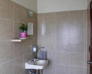 a bathroom with a sink and a toilet at Luffa Hostel in Santa Lucía +49 photos