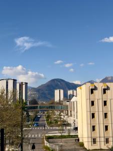 a city with buildings and mountains in the background at Les Marcassins - Cinéma privé - Alpexpo - 5 Chambres in Échirolles