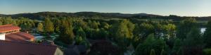 an overhead view of a forest of trees and a building at Lipno - apartmán C404 in Frymburk +5 photos