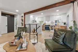 a living room with two chairs and a table at Charming house in Midtown District in Reno