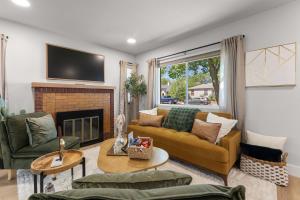 a living room with a couch and a fireplace at Charming house in Midtown District in Reno
