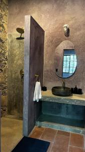 a bathroom with a sink and a mirror at Casa X in San Miguel de Allende +68 photos