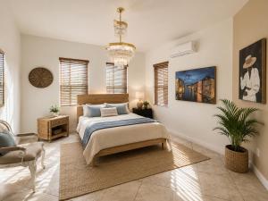 a bedroom with a bed and a chair at The Oasis, Miami Lakes in Miami Lakes +18 photos