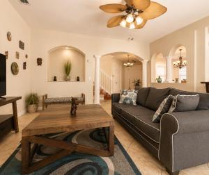 a living room with a couch and a table at The Oasis, Miami Lakes in Miami Lakes