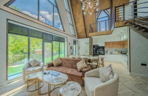 a living room with a couch and a table at Bungalov Azerbaijan in Vǝndam