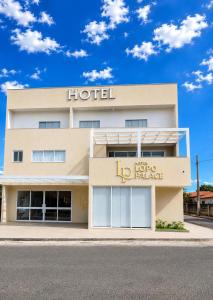 a hotel with a sign on the front of it at Lopo Palace in Porangatu