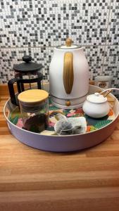a tray with a tea pot on a table at Viento Azul Guest House in Punta del Este +64 photos