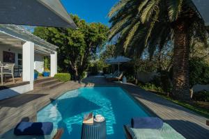 a swimming pool in the backyard of a house at theLAB BLUE in Franschhoek