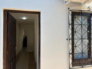 a mirror on a wall next to a hallway at 9 De Julio in Charata